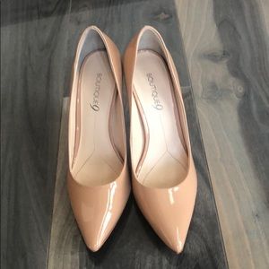 Patten leather pumps